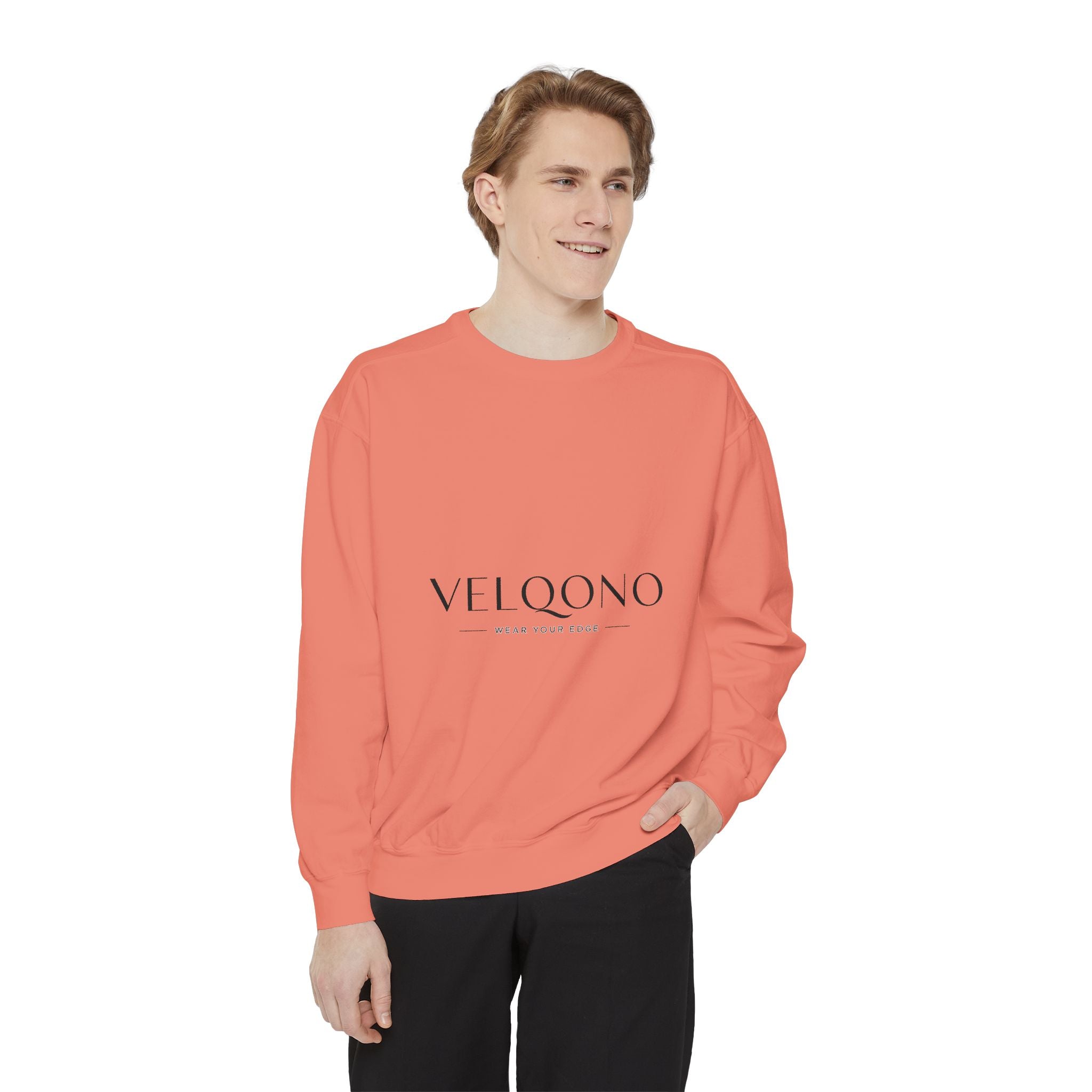 Person wearing a coral sweatshirt with a logo on a white background