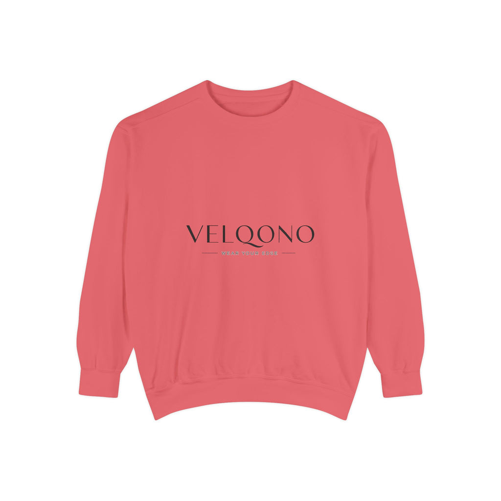 A coral pink crewneck sweatshirt with 'VELQONO' printed in black serif font across the chest, displayed on a clean white background.