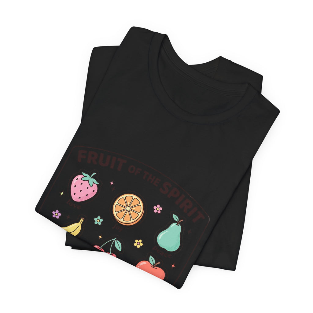 Two folded t-shirts displayed on a white table, with fruit motive on

